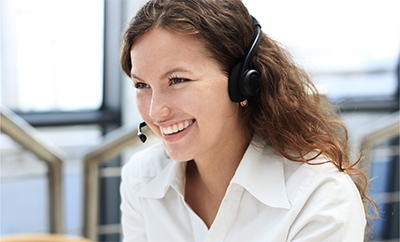 Female customer support operator with headset and smiling